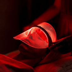 a woman wearing one of the best led face masks