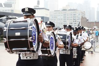 NY Police Department Marching Band Performs at Enterprise Reopening
