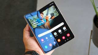 A Samsung Galaxy Z Fold 4 unfolded in someone's hand