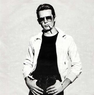 Graham Bonnet posing with cigarette and sunglasses