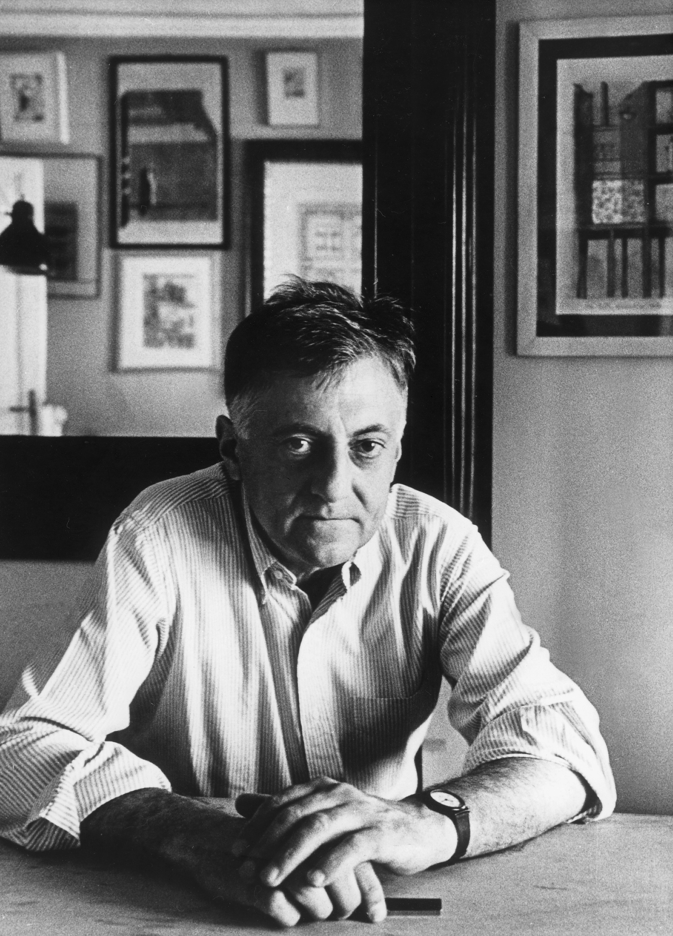 Italian architect Aldo Rossi in 1987, shot in black and white sat and looking straight at the camera