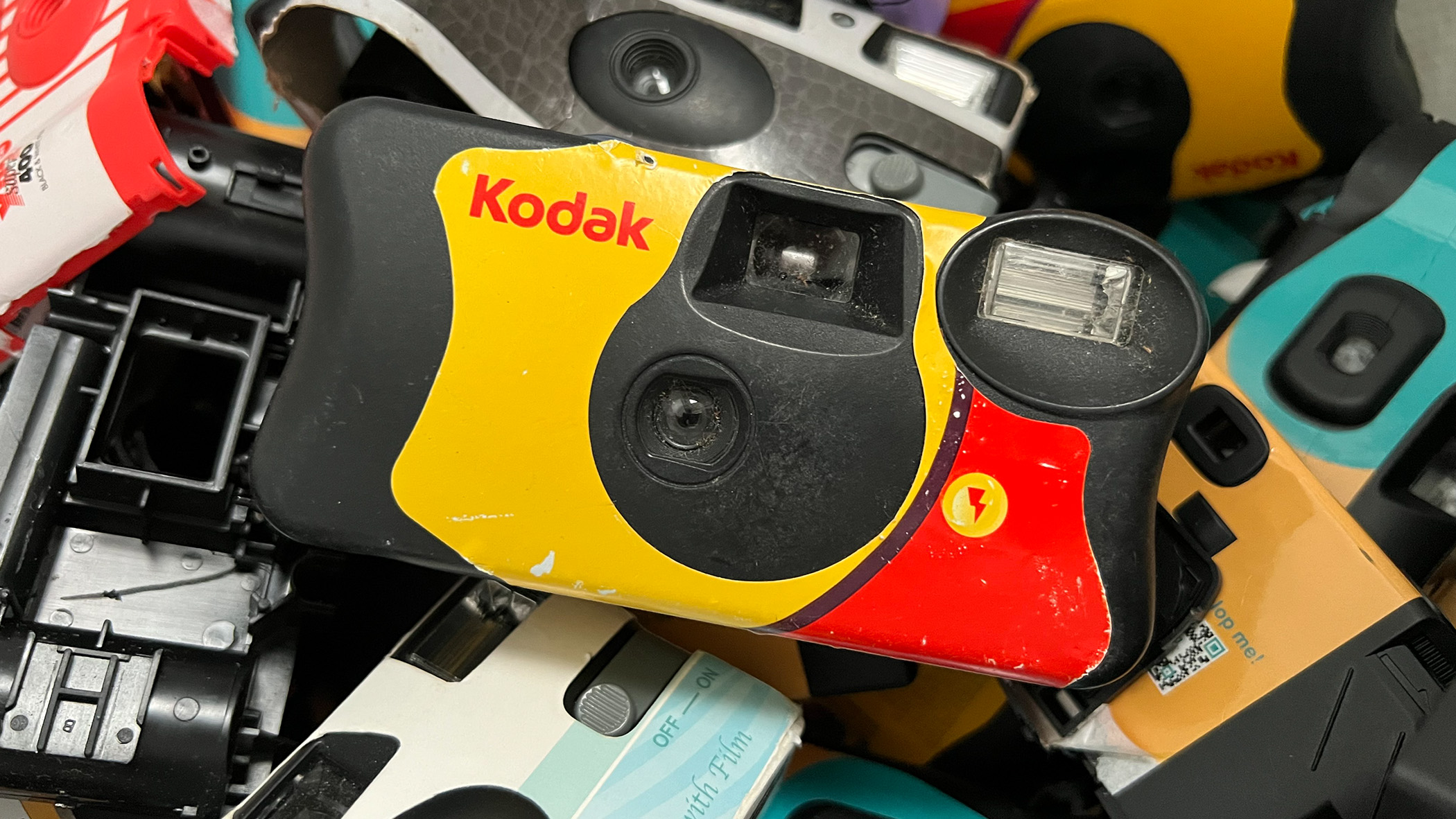 Disposable film camera being processed.
