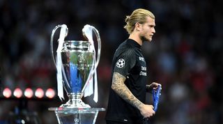 A dejected Loris Karius walks past the Champions League trophy after his mistakes in the 2018 final for Liverpool against Real Madrid.