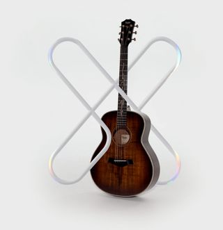 D'Addario XS logo and Taylor acoustic guitar