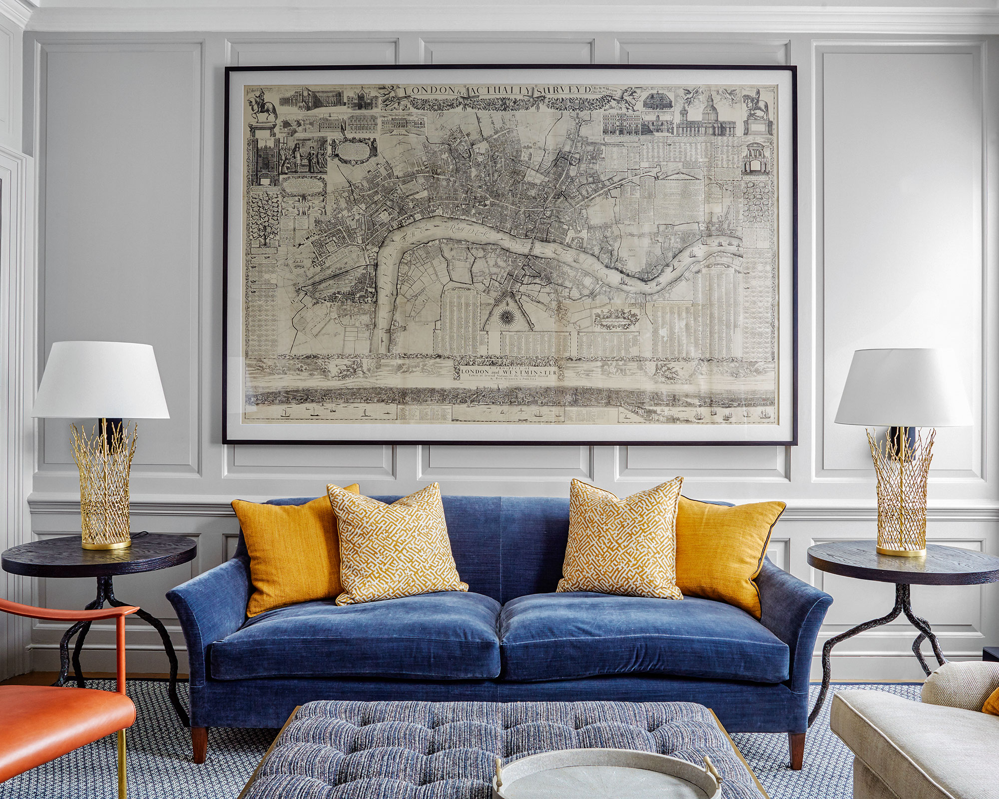 Living room with blue sofa and wall panelling