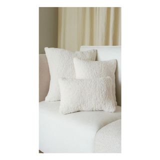 white sherpa throw pillow