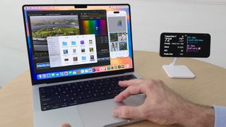 Apple&#039;s Craig Federighi demonstrating the iPhone Mirroring feature in macOS Sequoia and iOS 18 at the Worldwide Developers Conference (WWDC) in June 2024.