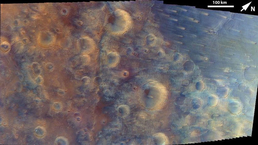 A slightly blurry view of a cratered surface.