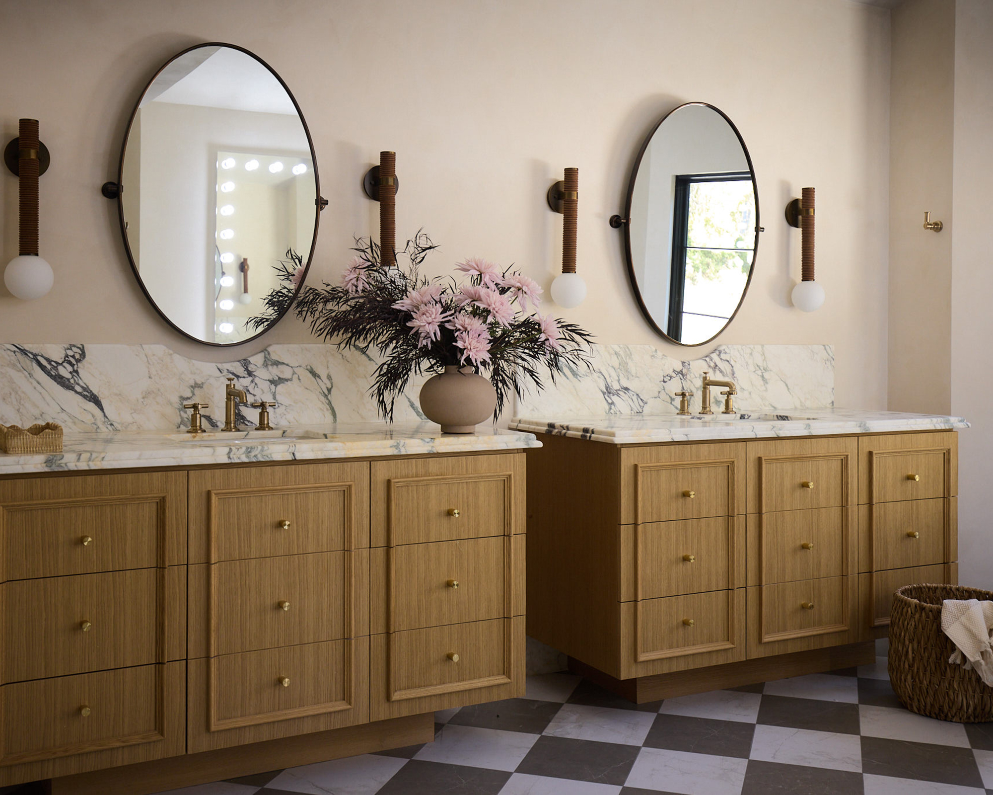 bathroom with double vanity and checkerboard floor