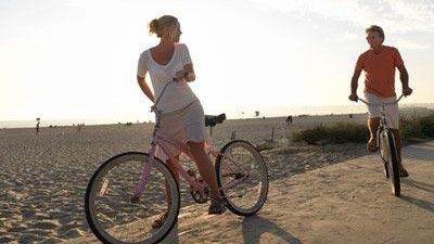 Couple on Bikes at Beach