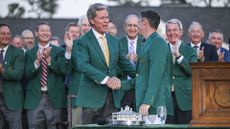 Rory McIlroy being congratulated by Augusta National Chairman Fred Ridley after the 2025 Masters