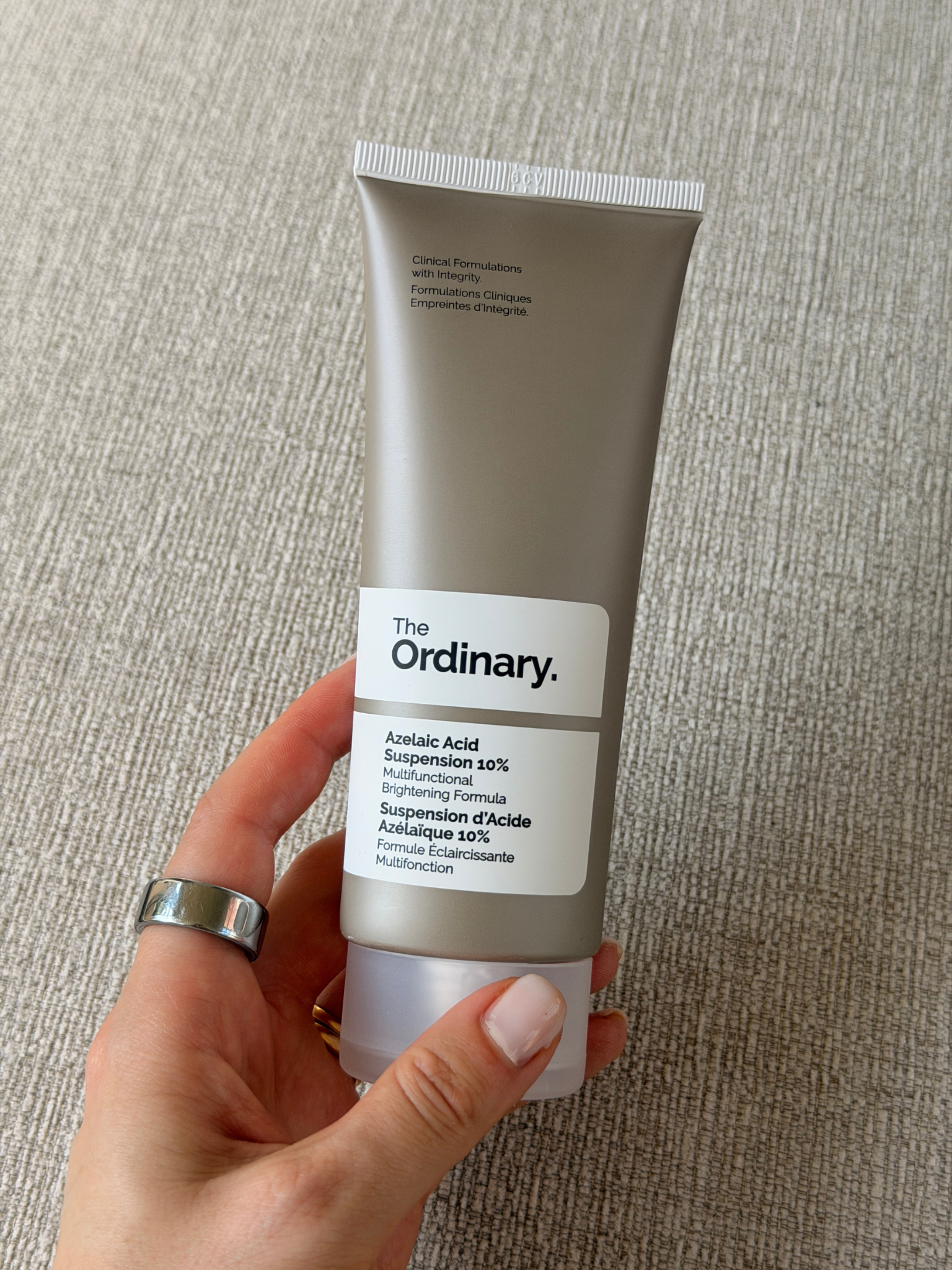 Grace holding The Ordinary Azelaic Acid Suspension