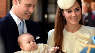 Britain's Prince William, Duke of Cambridge and his wife Catherine, Duchess of Cambridge, arrive with their son Prince George of Cambridge at Chapel Royal in St James's Palace in central London on October 23, 2013, ahead of the christening of the three month-old prince