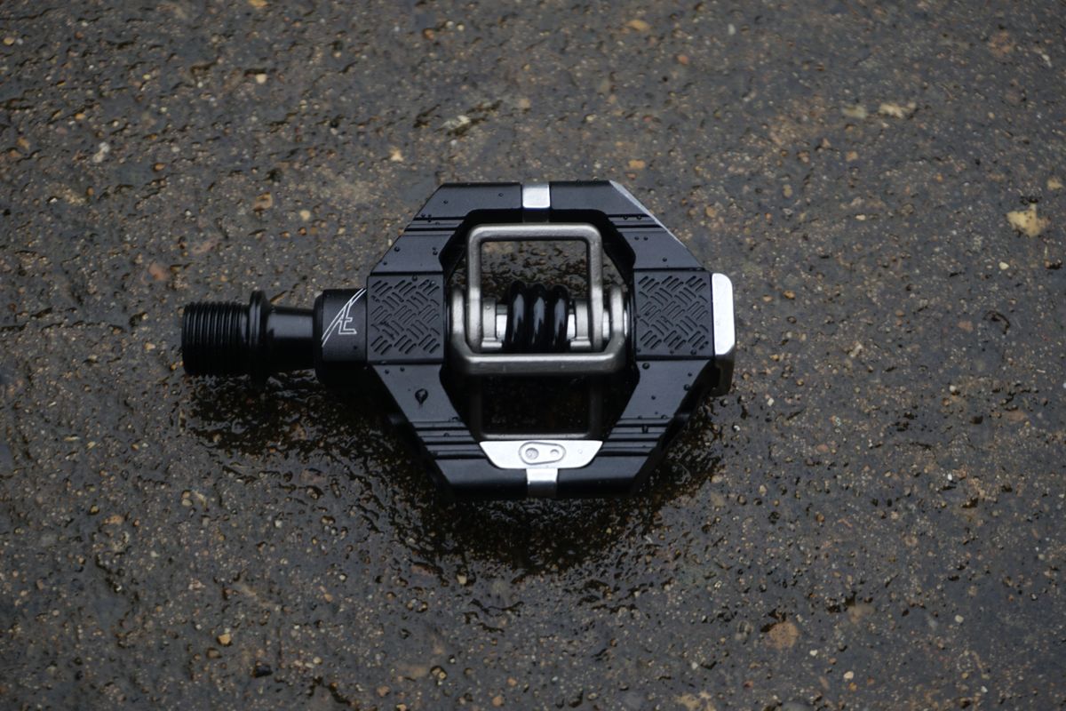 A close up of a black gravel bike pedal