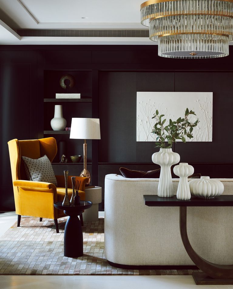 Black living room with sculptural lighting trends