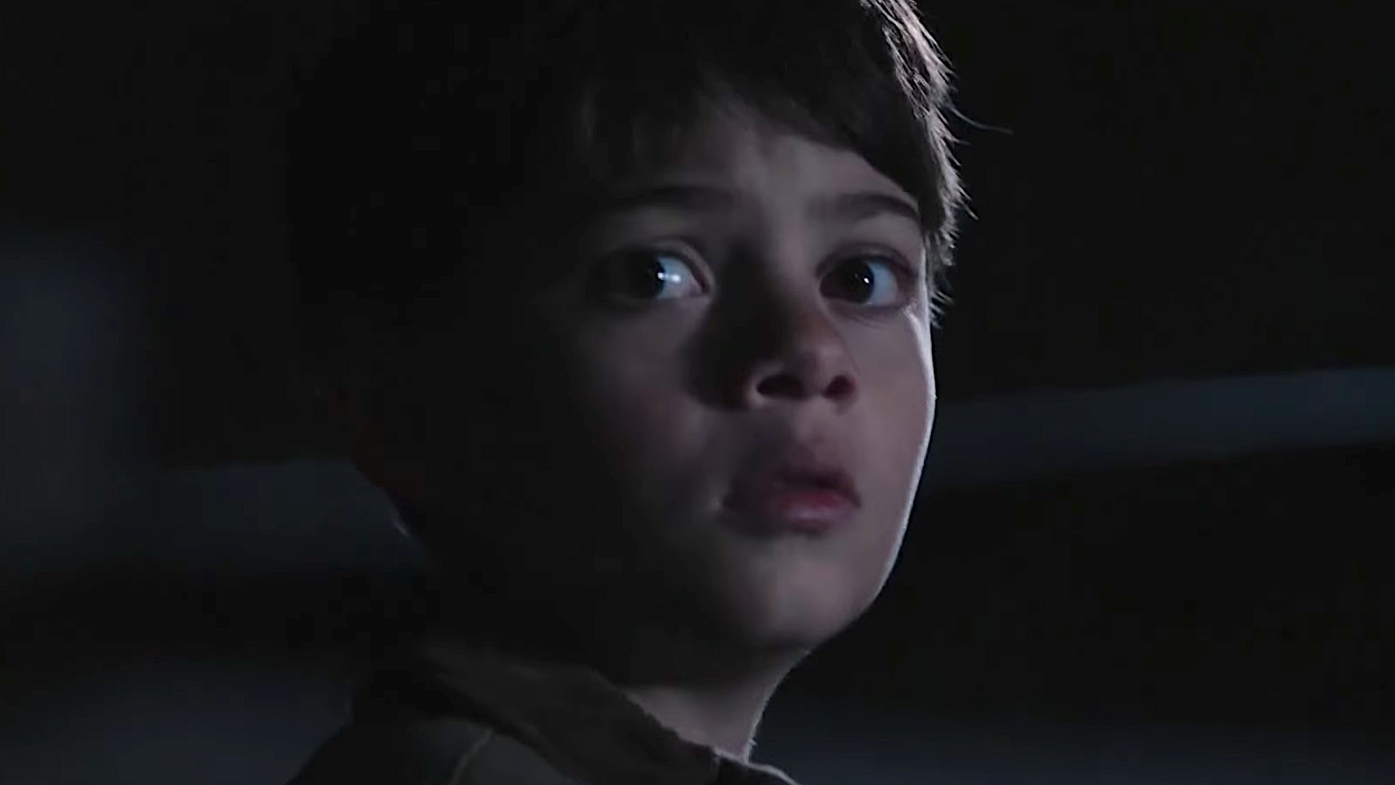 Tate turning with wide eyes before being kidnapped in Yellowstone Season 2