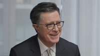 Stephen Colbert smiling while telling story during Strike Force Five reunion in May 2026