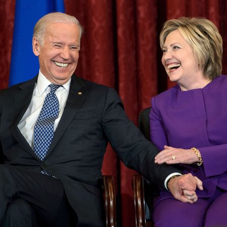 us vice president joe r biden l and former secretary of state hillary clinton laugh during a portrait unveiling for outgoing senate minority leader senator harry reid d nv on capitol hill december 8, 2016 in washington, dc afp brendan smialowski photo credit should read brendan smialowskiafp via getty images