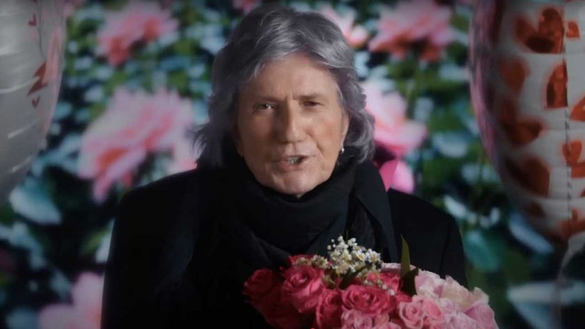 David Coverdale holding some roses