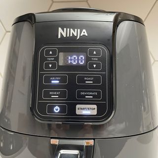 Close up of the Ninja AF100UK Air Fryer timer controls