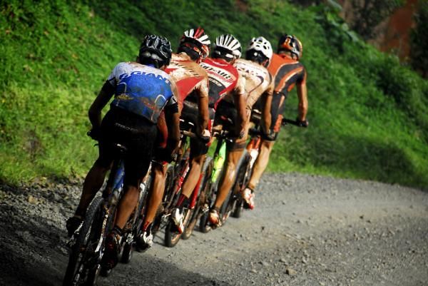 Racers draft each other on a road section of La Ruta