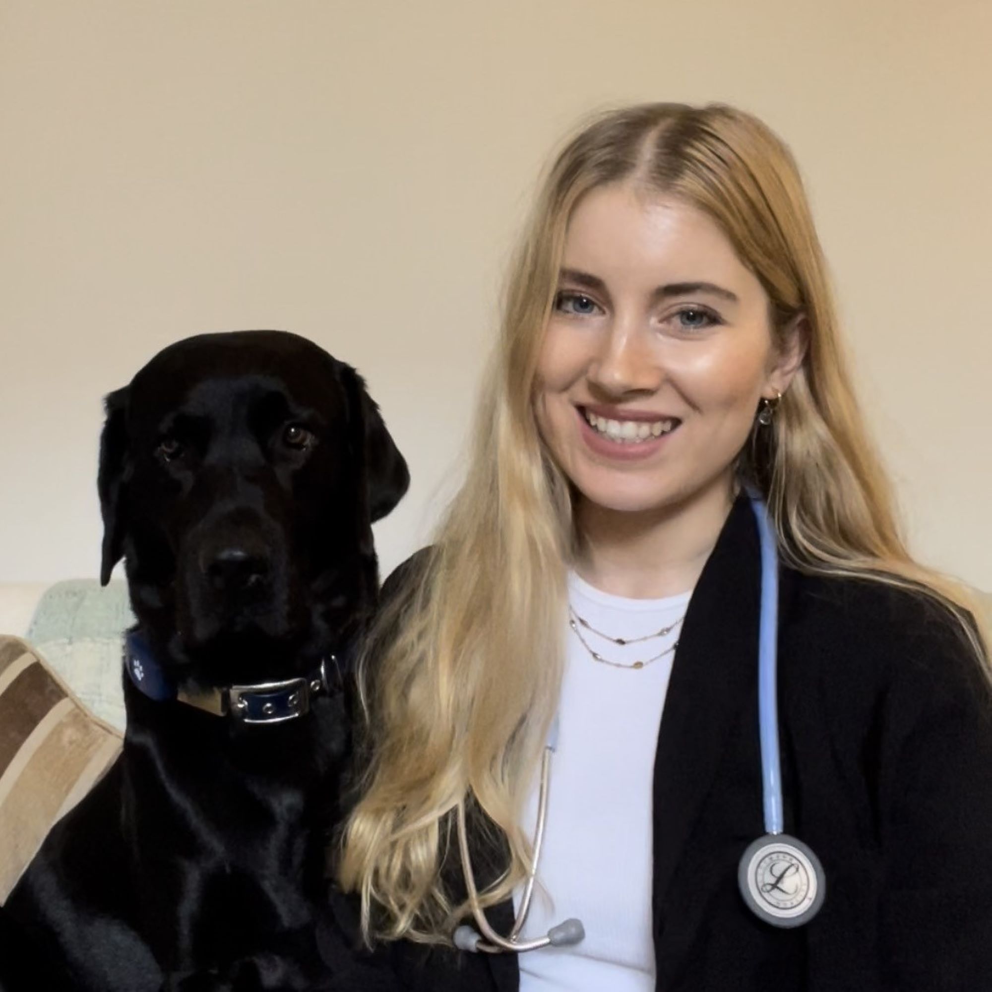 Headshot of vet with dog