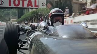 James Garner behind the wheel of a race car