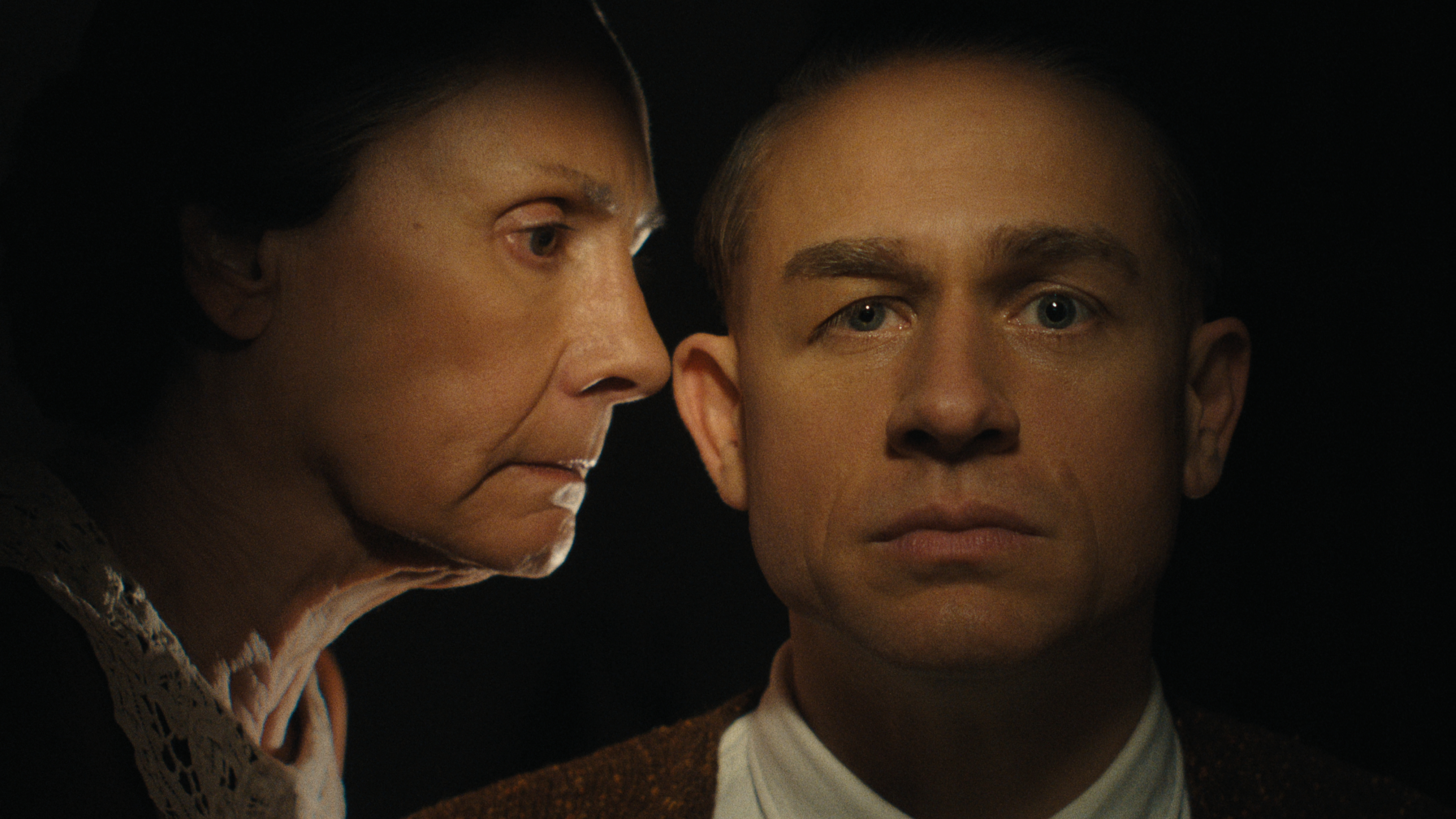 augusta gein talks in her son ed&#039;s ear in a still from monster the ed gein story