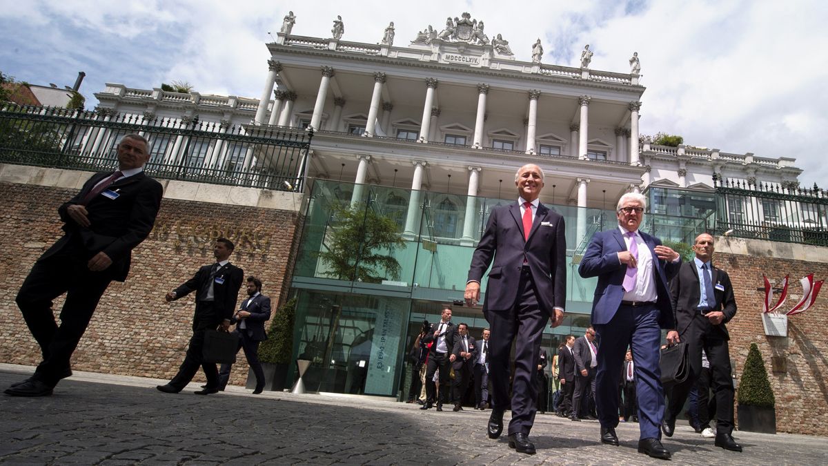 French Foreign Minister Laurent Fabius (L) and German Minister for Foreign Affairs Frank-Walter Steinmeier (R) arrives to address media outside of the Palais Coburg Hotel,where the Iran nucle