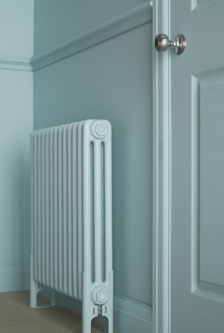 Blue room how to paint behind a radiator by Crown Paints