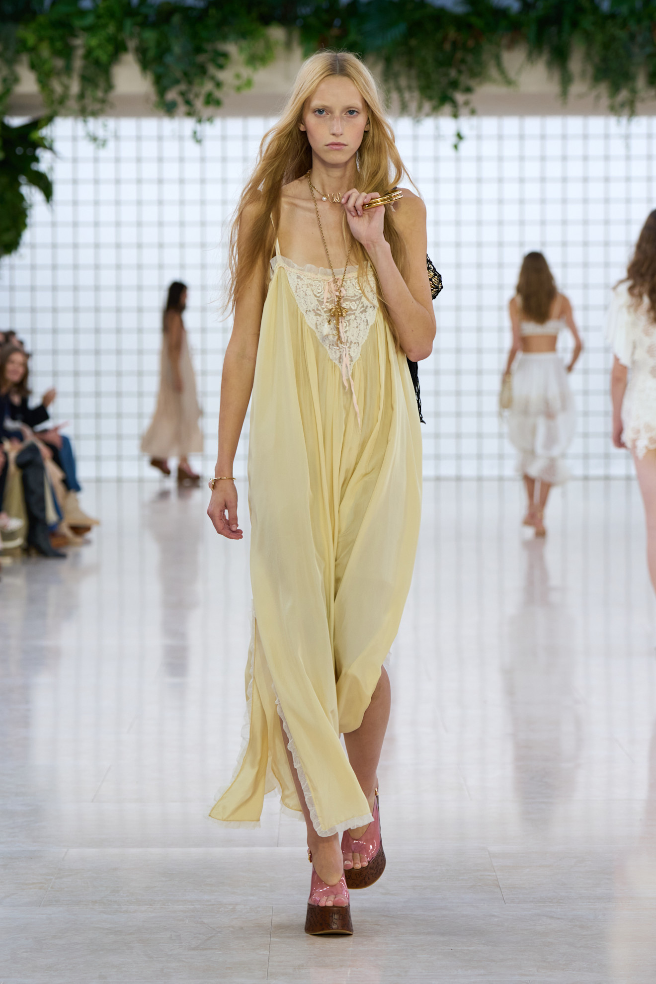 Pastel Fashion Colour Trends: A model wears a butter yellow dress on the Chloé spring/summer 2025 runway