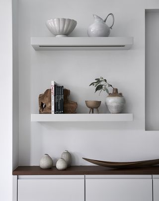 minimalist kitchen shelves with objets on them