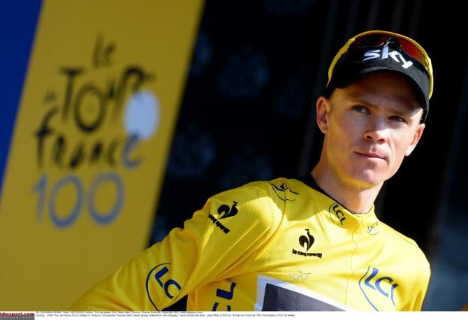 Chris Froome collects the yellow jersey after stage 10