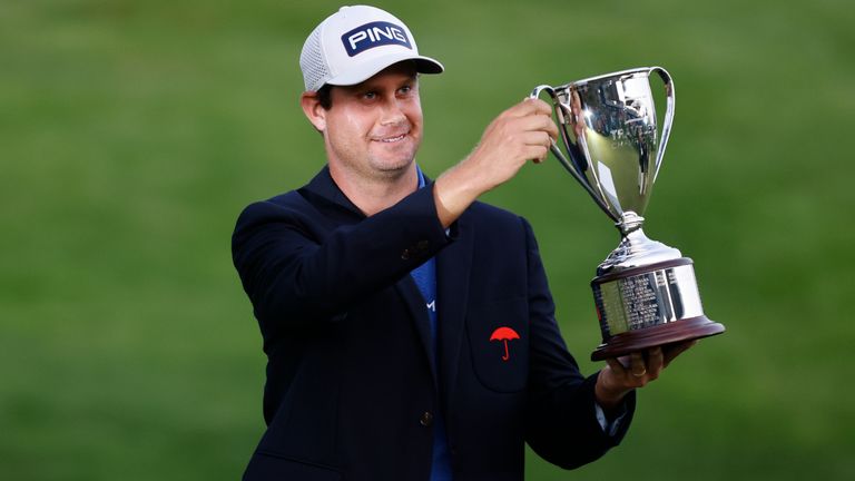 Harris English poses with the trophy after his win in the 2021 Travelers Championship