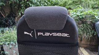 Close up of the logo on the back of the headrest of the PlaySeat Puma Active gaming chair
