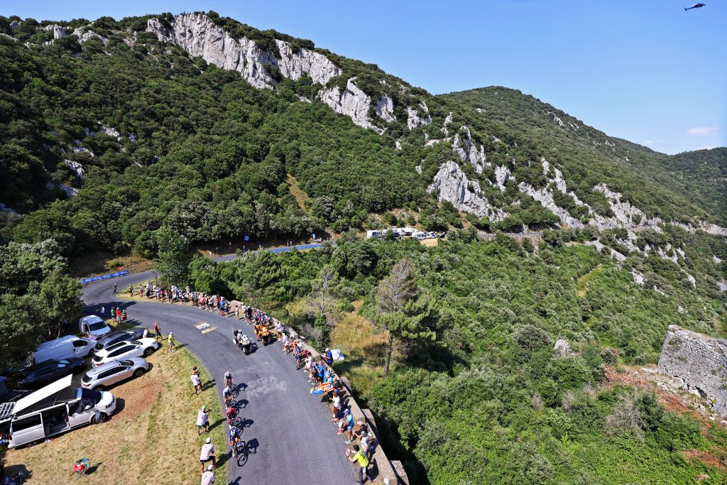 QUILLAN FRANCE JULY 10 Mattia Cattaneo of Italy and Team Deceuninck QuickStep Sergio Higuita of Colombia and Team EF Education Nippo Michael Woods of Canada and Team Israel StartUp Nation Patrick Konrad of Austria and Team BORA Hansgrohe in the Breakaway passing through Col de Saint Louis 706m during the 108th Tour de France 2021 Stage 14 a 1837km stage from Carcassonne to Quillan Landscape Mountains Fans LeTour TDF2021 on July 10 2021 in Quillan France Photo by Tim de WaeleGetty Images