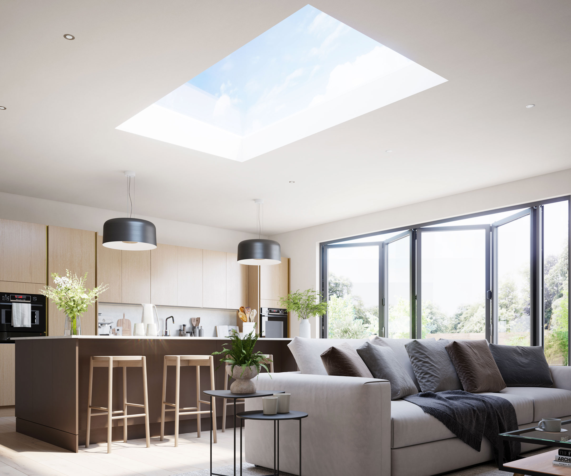 Large contemporary open plan living space with sofa, kitchen island, and bifold doors and flat glass roof light
