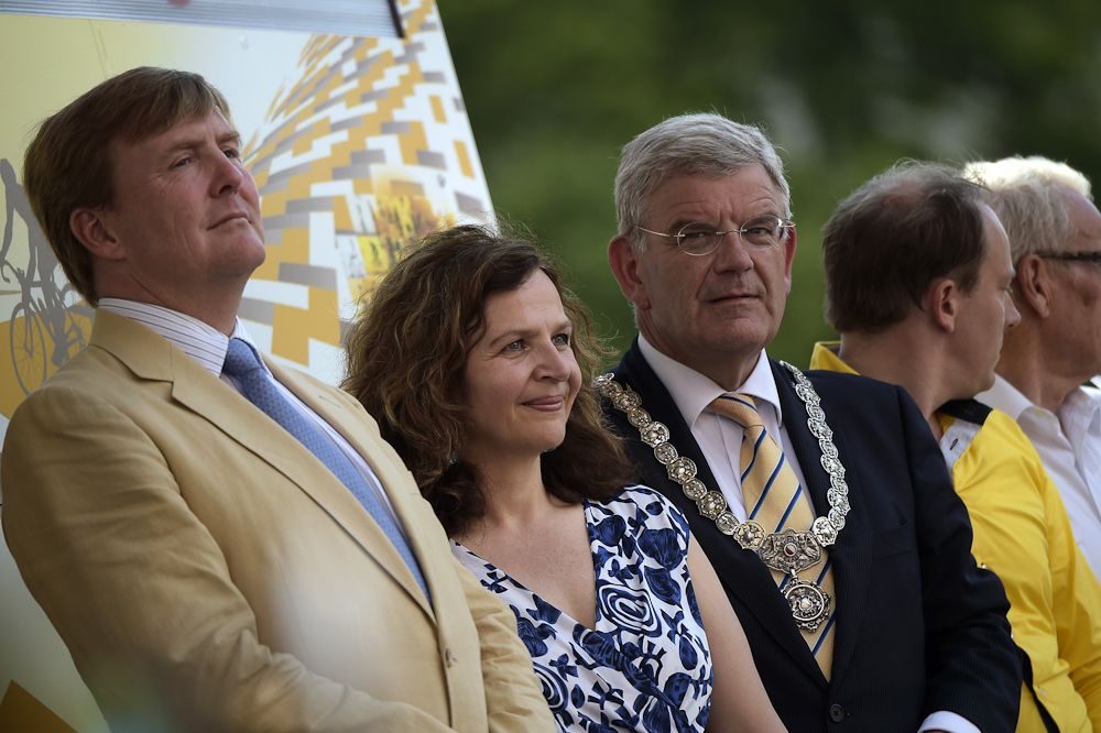 King Willem-Alexander of the Netherlands (L) and Utrecht's mayor Jan van Zanen (2ndR) pose on the podium at the end of a 13.8 km individual time-trial, the first stage of the 102nd edition of the Tour de France.