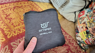 The Skysper foldable backpack in hand