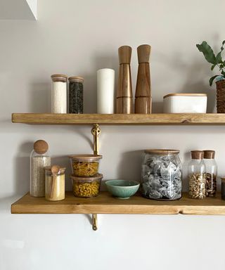 wood shelving with containers, food and othe pantry items
