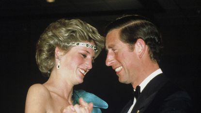 Princess Diana angered the Queen: Prince Charles, Prince of Wales and Diana, Princess of Wales, wearing a green satin evening dress designed by David and Elizabeth Emanuel and an emerald necklace as a headband, dance together during a gala dinner dance at the Southern Cross Hotel on October 31, 1985 in Melbourne, Australia