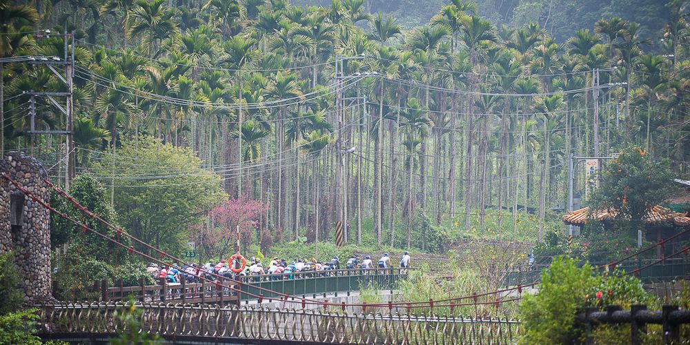The peloton rides through some scenic countryside at the Tour de Taiwan.