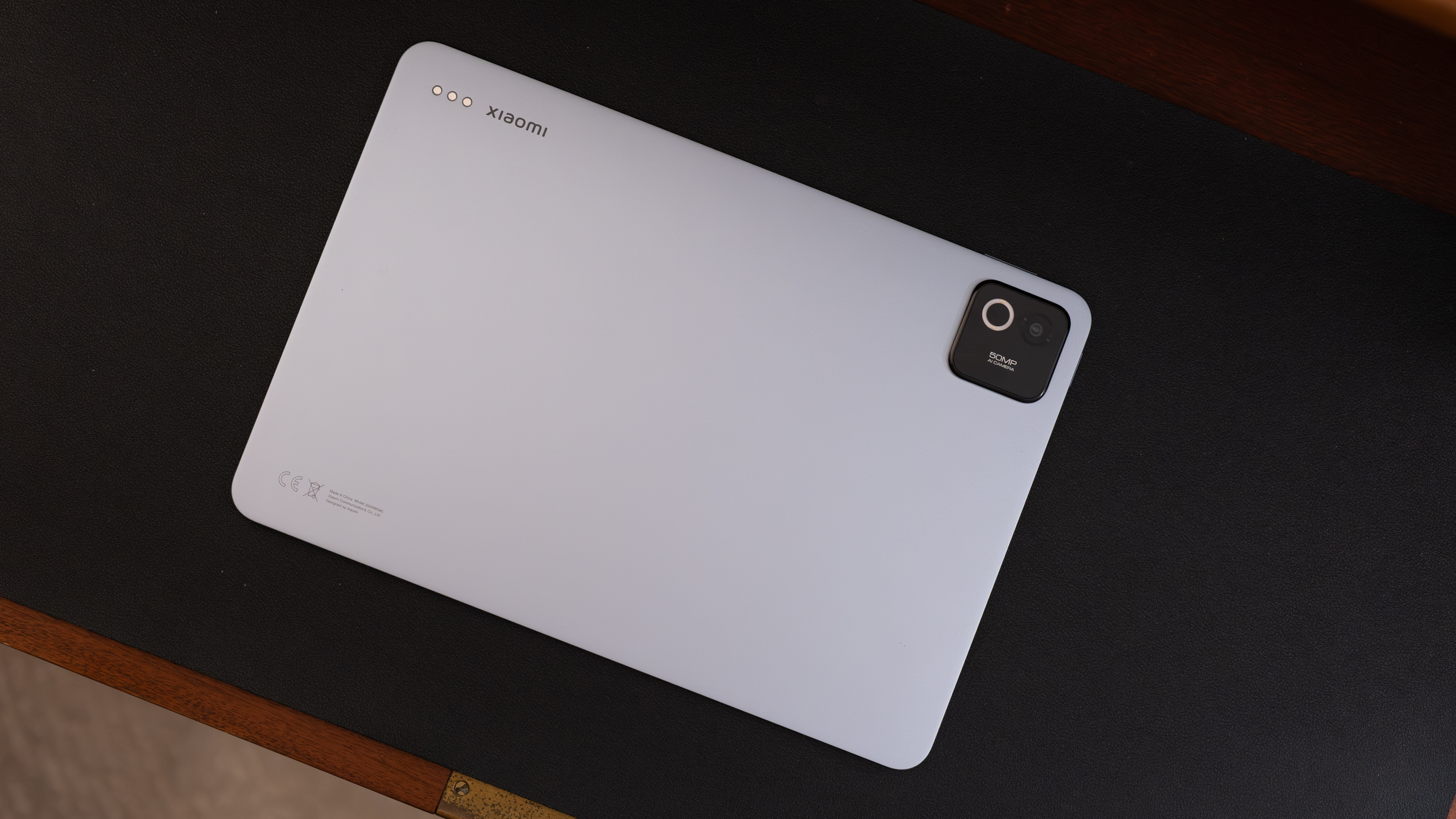 Rear view of the Xiaomi Pad 8 Pro lying flat, showing the matte silver back panel and square camera module.