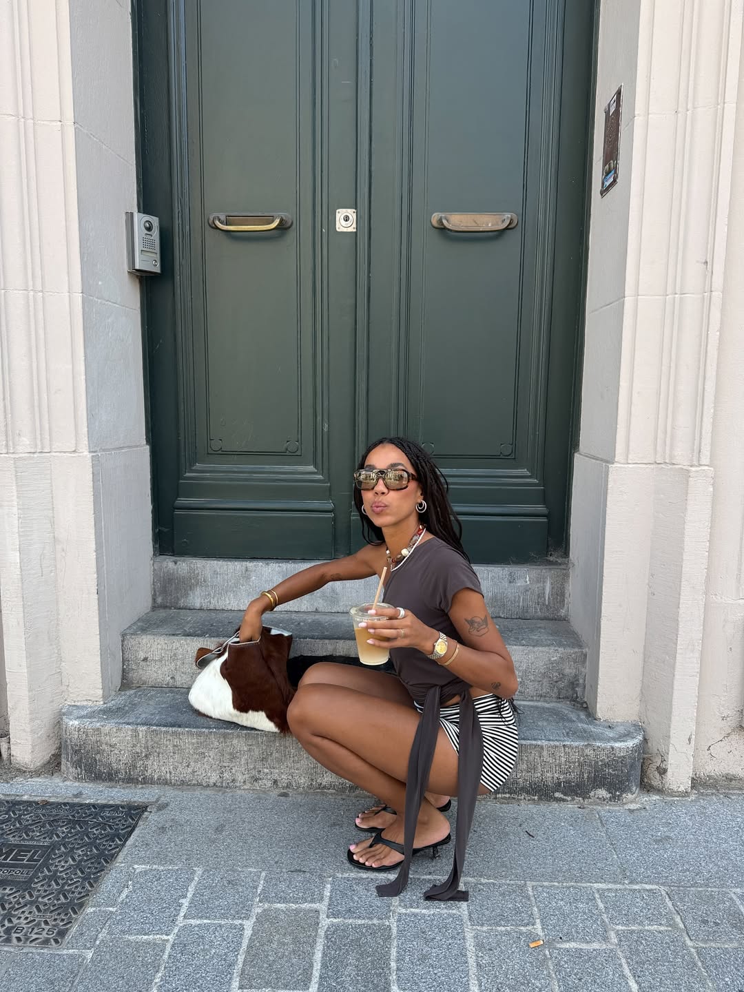 Amaka wearing shorts and flip flops