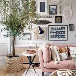 A white living room with pink sofa