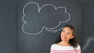 Woman thinking next to a thought bubble on a blackboard