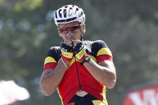 Philippe Gilbert kisses his Belgian champion's jersey goodbye after taking the first maillot jaune.