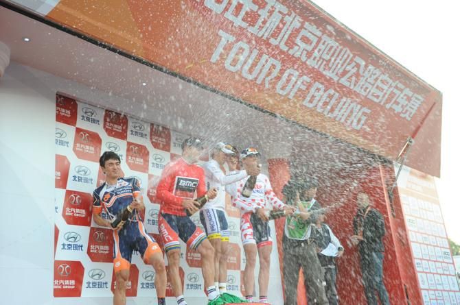 The Tour of Beijing stage 1 jersey holders let loose with the champagne