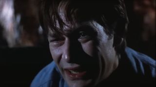 James Remar bent over with a look of anguish in Tales from the Darkside: The Movie.