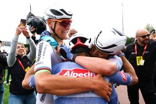 Mathieu van der Poel and Jasper Philipsen celebrate after finishing 1-2 at Paris-Roubaix